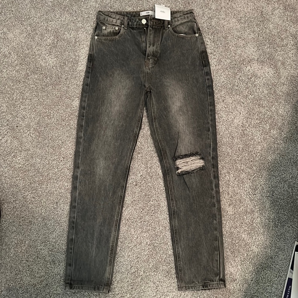 NWT! Adika light wash black denim jeans with knee rip!